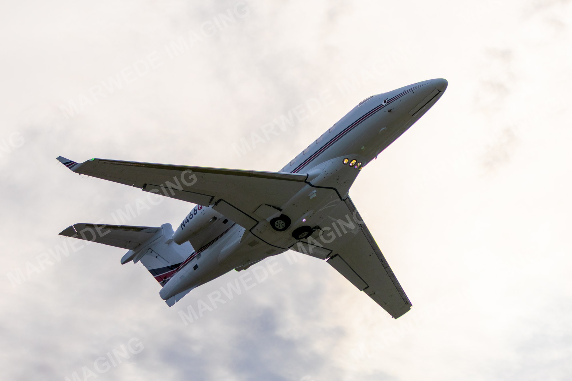 Embraer Phenom 300 N466QS photographed at KBCT on 2025-05-11